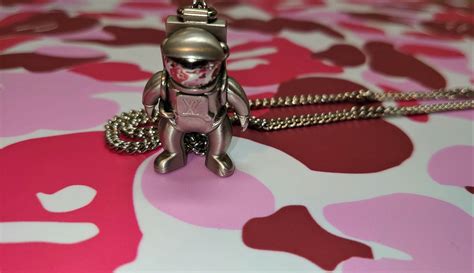 louis vuitton astronaut necklace fake|false louis vuitton wallet symbol.